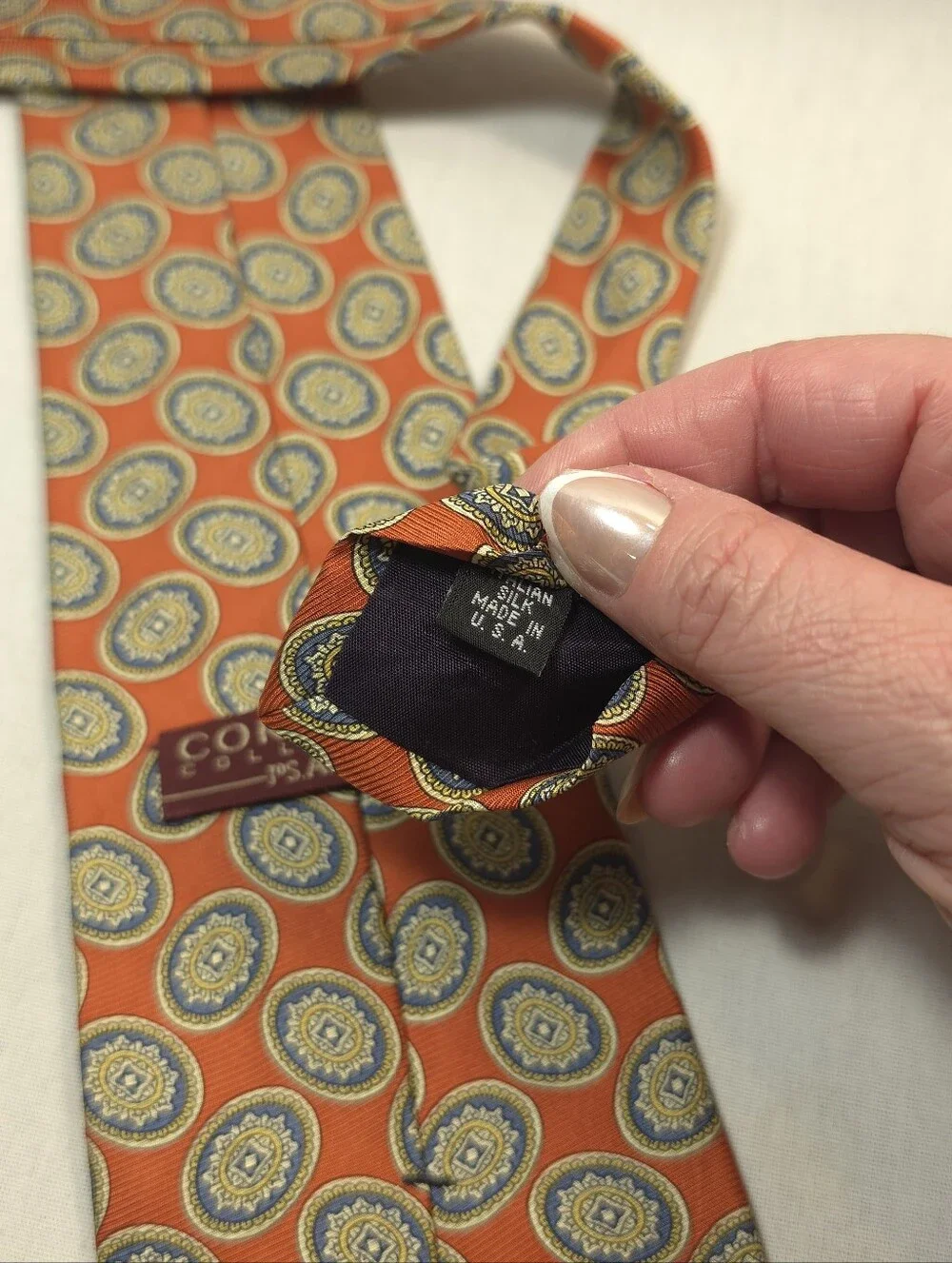 Jos. A. Bank Orange Tie with Blue and Gold Medallions